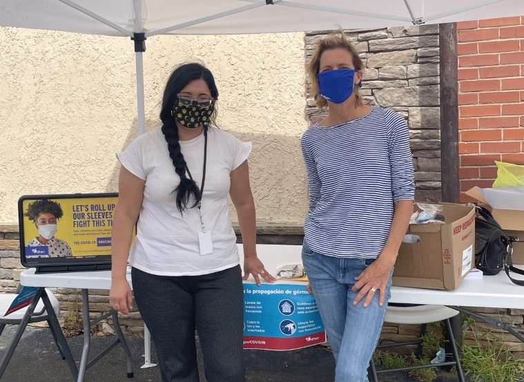 Ana Garcia, DHEC's Outreach Strategist and Dr. Lorilei Swanson, Upstate Regional Family Engagement Liaison, outside a local business, La Estrella.